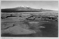 Aerial view overlooking Waiouru Military and Mount Ruapehu, 5 February, 1952. Mount Ngauruhoe is visible on the right. Photograph taken by Gorden Burt. Although taken after the war, this photo shows the rugged terrian and outlook of the Cental North Island where NZ recruits did a lot of their basic training for WW2 and have for the NZ Army ever since.