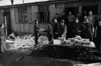 Mail arriving at an unidentified prisoner of war camp in Germany. Red Cross photograph. circa 9 Mach 1942.  Note on back of file print reads 