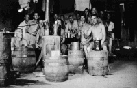 Unidentified group with their secret distillery at Stalag 18A, a German prisoner of war camp in Wolfsberg, Austria, circa 1944.  Photograph taken by John H Ledgerwood