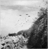 German Junkers Ju-52 Transport dropping Paratroopers on Crete. Photograph taken by EKS Rowe. ca 1941.