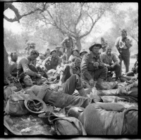 New Zealand troops in the transit area between Canea and Galatos, Crete, upon arrival from the Greek Mainland. E W Garrod is in the foreground. This group involved in the last reargruard action before the withdrawal from Crete. 