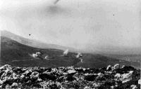'Long Range Snipers' - 4th Feild Regiment Shells burst on road, Greece. 1941.