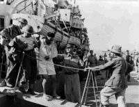 Injured Soldier disembarking off a ship in Alexandria, Egypt after the campaign in Crete, May 1941.