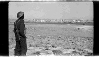 Unidentified New Zealand soldier looking across to Tobruk (Tubruq), Libya, during World War II. Photograph taken in 1941.