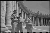 New Zealand soldiers on leave in Rome, 2 July 1944. Shows Captain J W Bateman, Second Lieutenant P G Brown, and Captain J D Snow, standing in Piazza San Pietro (St Peter's Square). Photograph taken by George Kaye.
