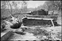Two wrecked World War II tanks outside the villa Sfacciata, on the road between Giogoli and Galuzzo, south of Florence, Italy. Shows a German Tiger tank from schwere Panzer-Abteilung 508, and a New Zealand Sherman tank, probably from 20th Armoured Regiment.  Photograph taken on 4th August 1944 by George Kaye