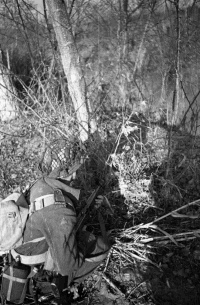 A NZ infantryman makes use of natural cover the forward area of the Italian front near Faenza.  Photograph taken by George Kaye on the 1st of December, 1944.