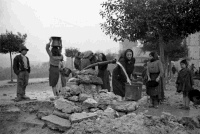 Women collecting water in the war damaged village of Gessopalena, Italy.  Photograph taken by George Kaye, 16 December 1943