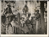 New Zealand nurses from the New Zealand General Hospital during the withdrawl from Greece. Shows a group of eight unidentified nurses in a cemetry, where they sheltered for a day from enemy planes. Photograph taken circa, July, 1941.