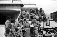 The crew of a New Zealand tank with some of Marshall Tito's men in Trieste, Italy.  Phtotographed by George kaye on the 4th of May 1945