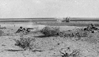 Defensive line of Vickers machine gun posts manned by the 8th Army at El Alamein. Photograph taken by H Paton, November 1942.
